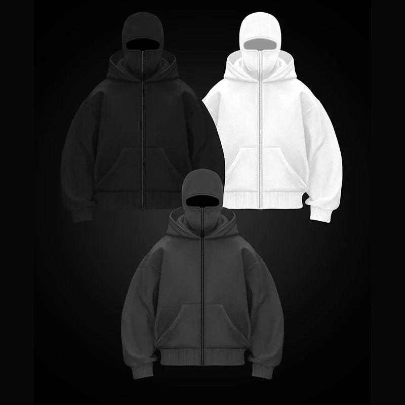 Three hoodies in black, white, and gray on a black background