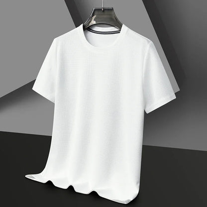 White t-shirt on a hanger against a gray background