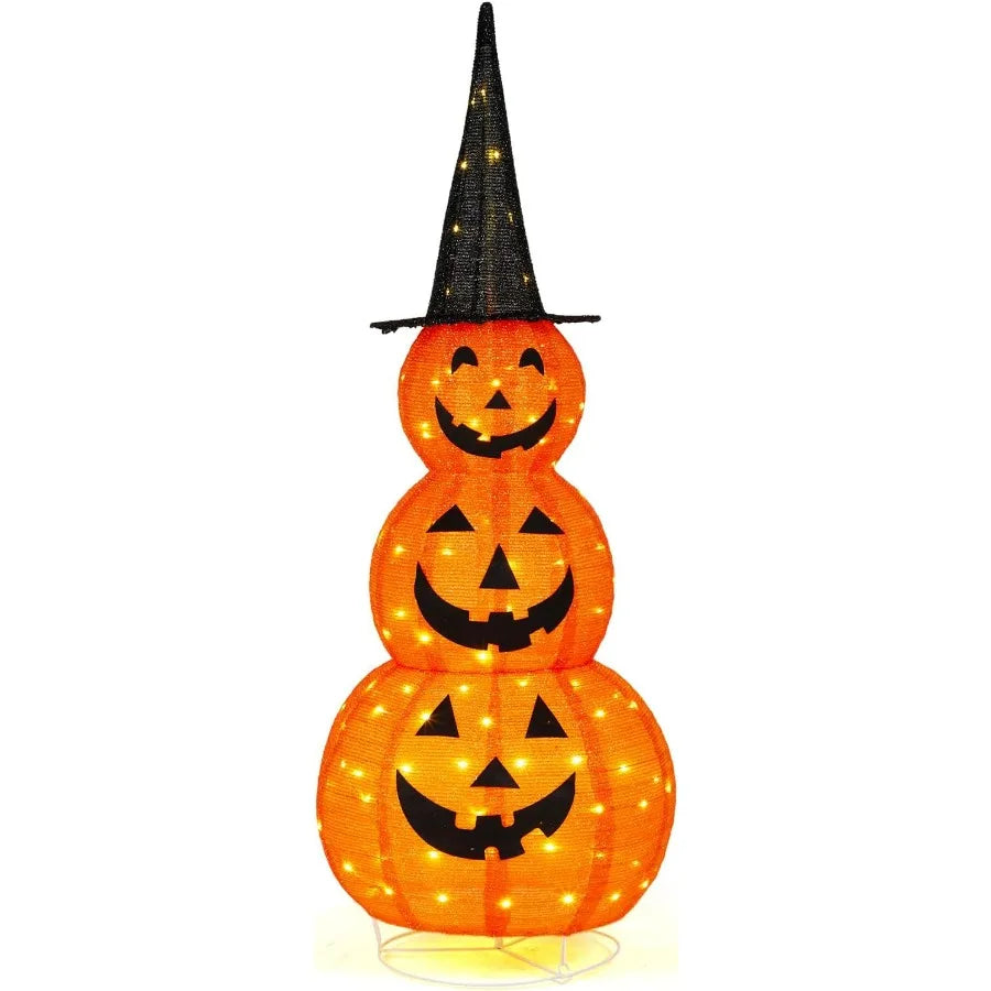 Stack of three illuminated pumpkins with a witch hat on a white background