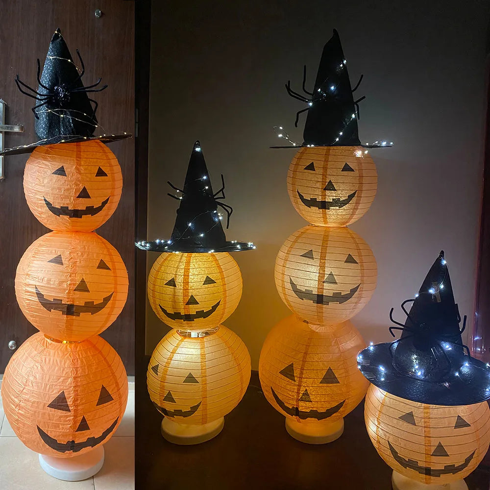 Halloween-themed lanterns with witch hats and jack-o'-lantern faces on a wooden surface.