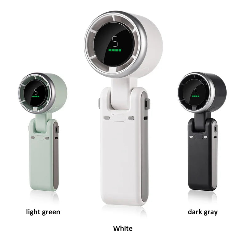 Three models of a portable device in light green, white, and dark gray on a white background.