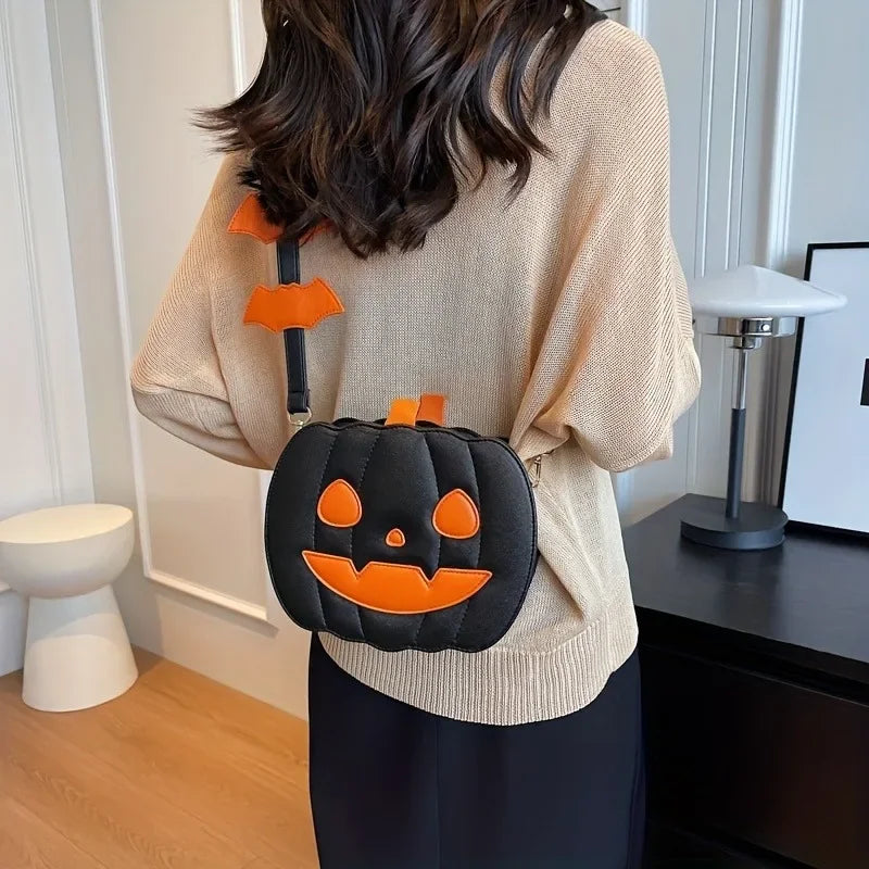 Person wearing a Halloween-themed black and orange pumpkin bag indoors.