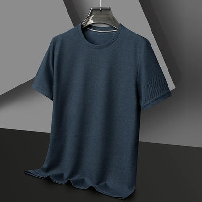 Blue t-shirt on a hanger against a gray background