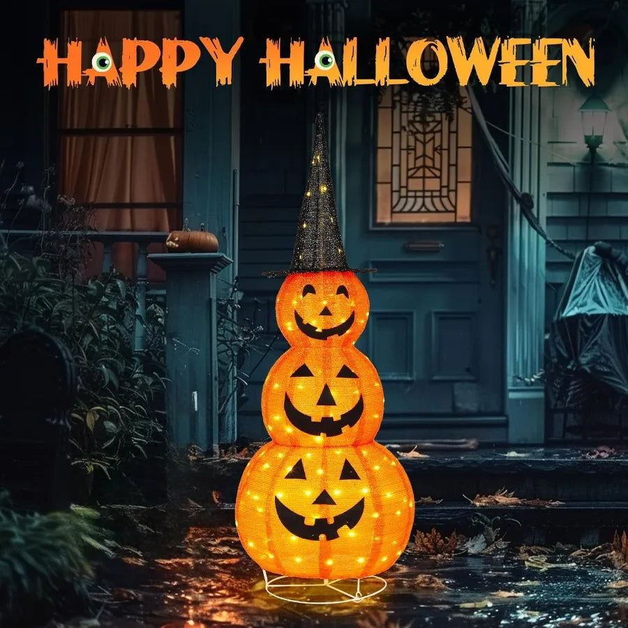 Halloween-themed decoration with stacked jack-o'-lantern lights in front of a house.