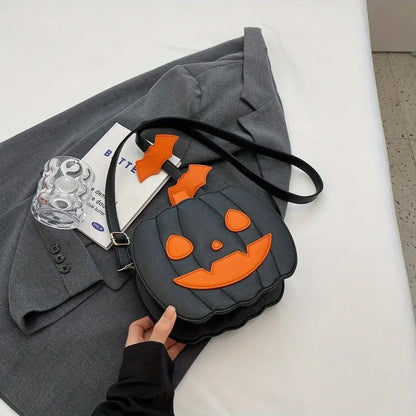 Pumpkin-shaped bag with orange face design on a gray coat